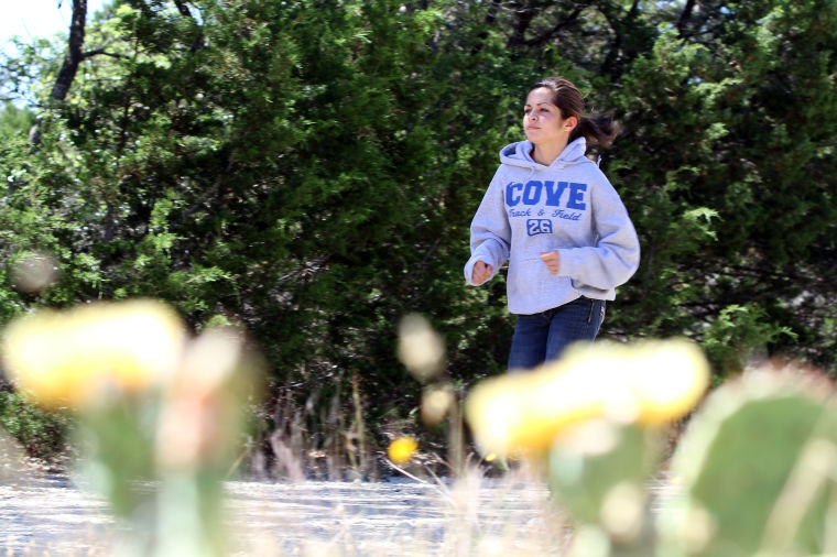 Cove distance runner commits to Rice